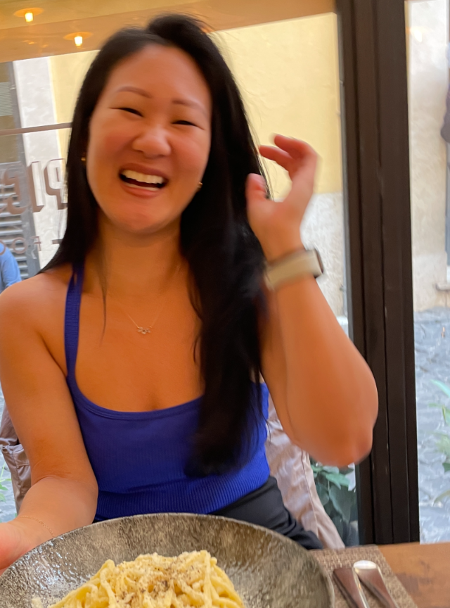 Laughing over pasta in Italy